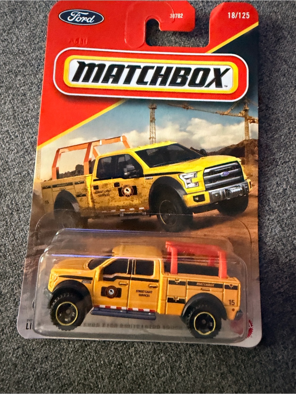 Matchbox Ford Yellow Utility Rescue Pickup Toy with Orange Roll Bar